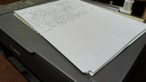Stack of Printed Papers on Office Printer Tray Stock Photos