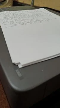 Stack of Printed Papers on Office Printer Tray Stock Photos