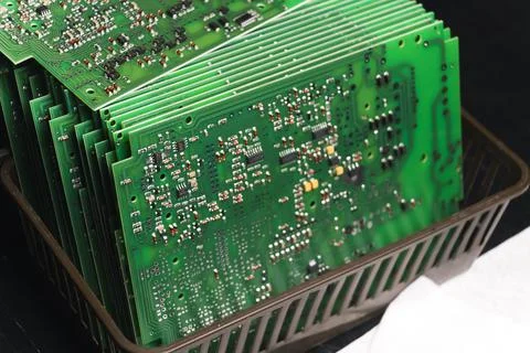 Stack of produced printed circuit boards with surface mounted components. Stock Photos