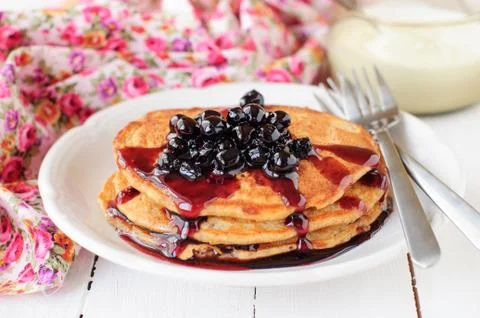 A Stack of Pumpkin Pancakes Topped with Chokeberry Preserves, copy space for  Stock Photos