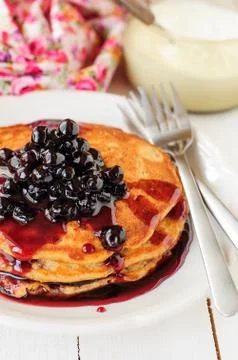 A Stack of Pumpkin Pancakes Topped with Chokeberry Preserves, copy space for  스톡 사진