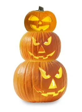Stack of pumpkins with carved spooky faces on white background. Halloween j.. 스톡 사진