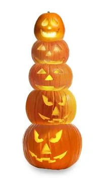 Stack of pumpkins with carved spooky faces on white background. Halloween j.. Stock Photos