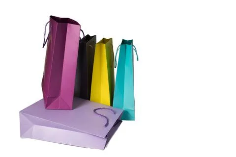 Stack of purple, violet, and magenta fashion bags for event Stock Photos