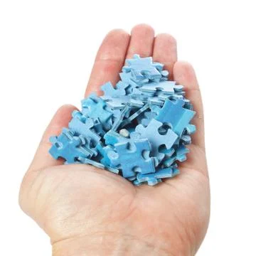 A stack of puzzles palm on a white background. Stock Photos