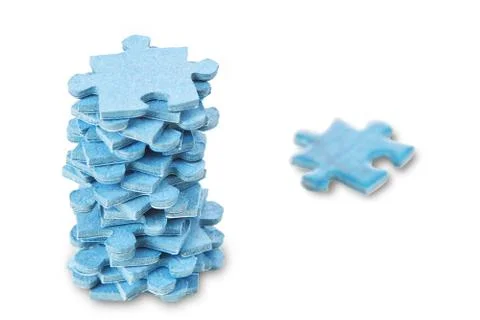 A stack of puzzles on a white background. Stock Photos