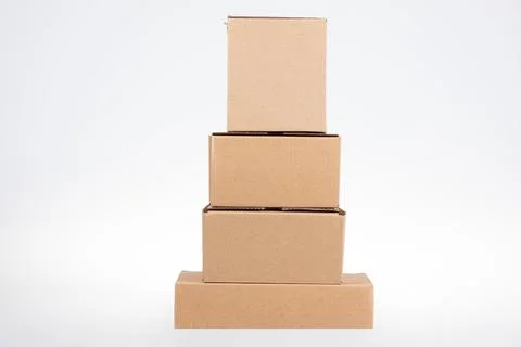 Stack of pyramid four cardboard boxes of different sizes on white background Stock Photos