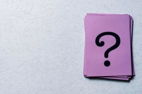 Stack of question marks on purple paper Stock Photos