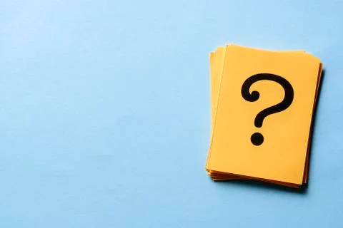 Stack of question marks on yellow cards Stock Photos