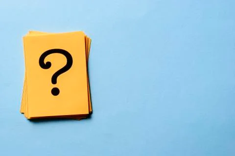 Stack of question marks on yellow cards Stock Photos