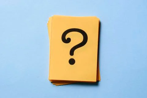 Stack of question marks on yellow cards Stock Photos