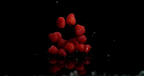 Stack of raspberry bounce in air super slow motion Video stock 249614808