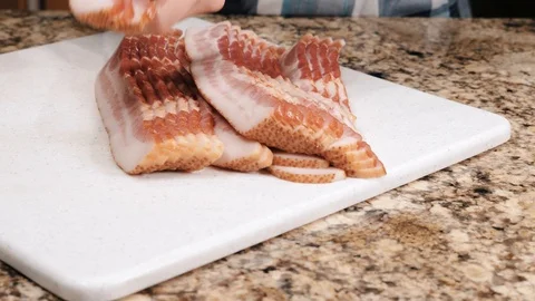 Stack of raw bacon slices, panning shot Stock-Footage 102605948