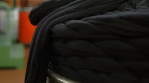 Stack of Raw Black Wool Fibers Stored in Textile Production Area Stock Footage 328643566