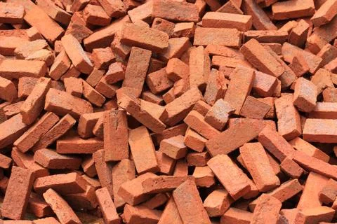 Stack of raw bricks. Stock Photos