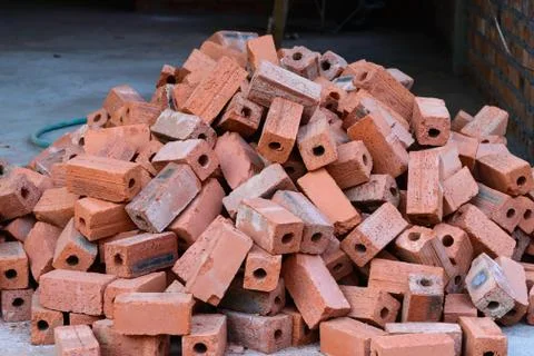 Stack of raw bricks. Stock Photos