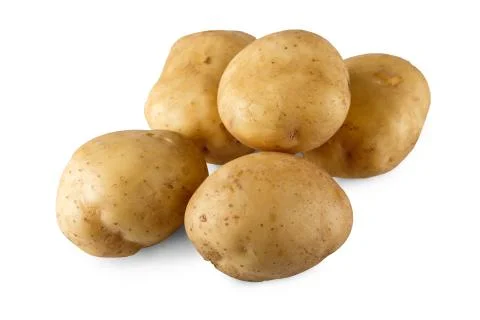 Stack of raw potatoes closeup isolated on white background Foto stock