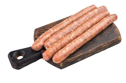 Stack of raw sausages on white background. Fresh seasoned minced meat links.. Stock Photos