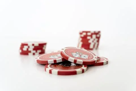 Stack of realistic red chips for casino on white background Stock Photos