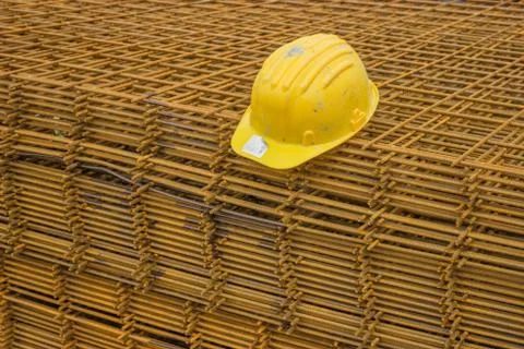 Stack of rebar grids with yellow helmet Stock Photos