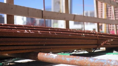 Stack of rebar lies on stylage in form of rusty rods on street. Stock Footage 241106805