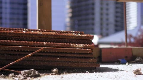 Stack of rebar lies on stylage in form of rusty rods on street. Stock Footage 241106945
