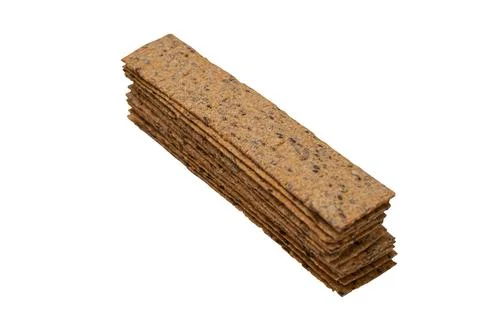 Stack of rectangular bread crisps isolated on white background. Top view clos Foto stock