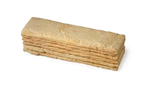 Stack of rectangular crispy wheat crispbread sticks on a white background Foto stock