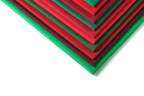 Stack of red and green fabrics on white background, space for text Stock-Fotos