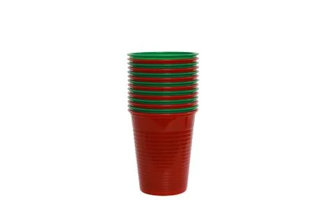 Stack of red and green plastic cups isolated on a white background 库存照片