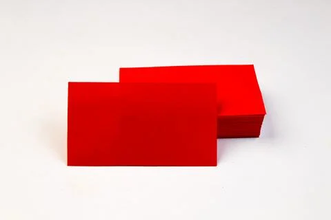 Stack of red blank business cards on white background. Stock Photos