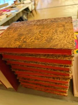 Stack of red books with brown marbled covers Stock Photos