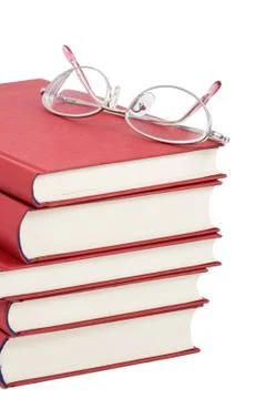 Stack of red books with eyeglasses Stock Photos