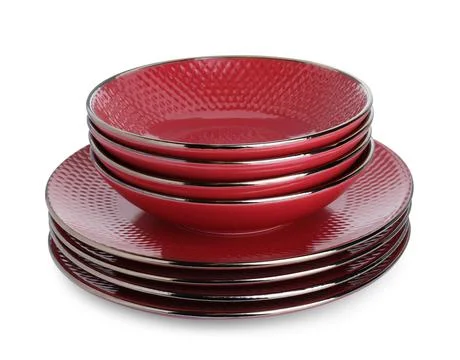Stack of red bowls and plates isolated on white Stock Photos