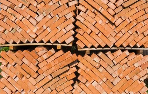 Stack of red bricks as a background or texture. Stock Photos