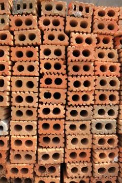 Stack of red bricks, bricks used for building construction Stock Photos