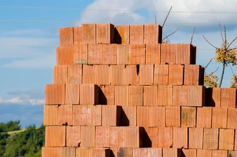 Stack of red bricks, bricks used for building construction Stock Photos