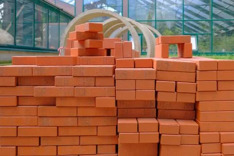 Stack of red bricks for build construction. Stock Photos