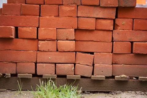 Stack of red bricks on a building site. 写真素材