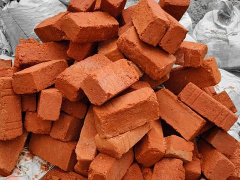 Stack of red bricks in construction site. Outdoors. Daylight condition Stock Photos