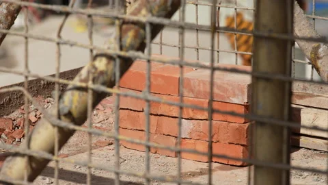 A stack of red bricks lies on a construction site, close-up Video stock 172255936