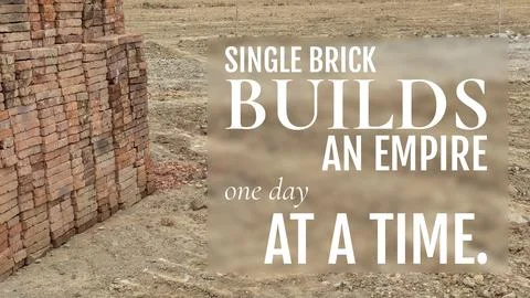 A stack of red bricks sits on a dirt construction site, featuring the quote.. Stock Photos