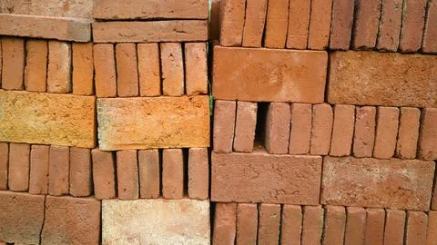 Stack of red bricks textured background 写真素材