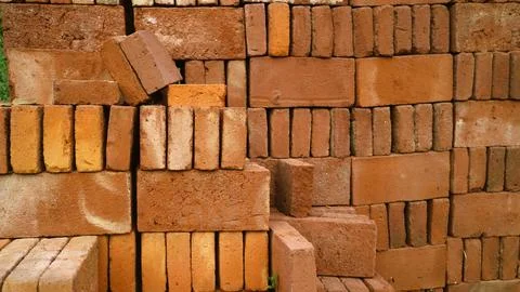 Stack of red bricks textured background 写真素材