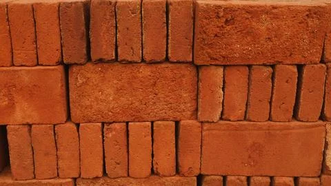 Stack of red bricks textured background Stockfoto's