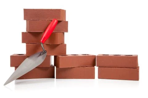 Stack of red bricks on white 写真素材