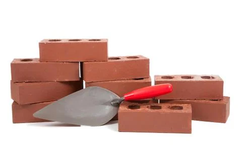 Stack of red bricks on white 写真素材