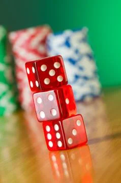 Stack of red casino dice against gradient background Stock Photos