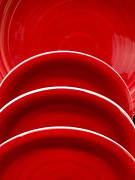 Stack of red ceramic plate dishes Stock Photos