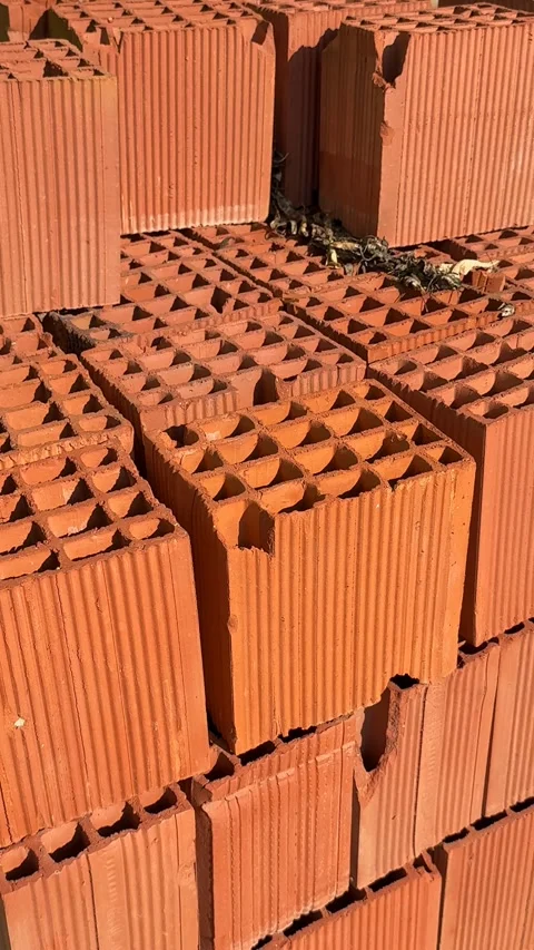Stack of red clay bricks arranged in sunlight, suitable for construction-th.. Stock Footage 327146720